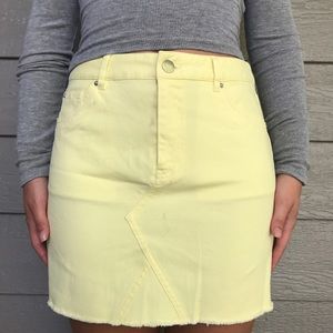 A yellow jean skirt